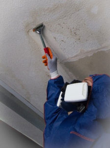 photo of asbestos contractor removing artex from a ceiling