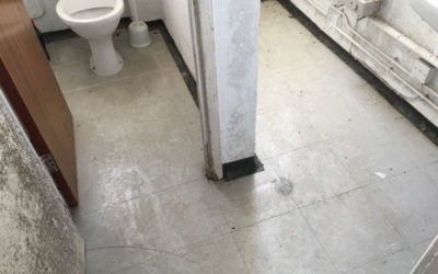 What are asbestos floor tiles, and how can you identify them?